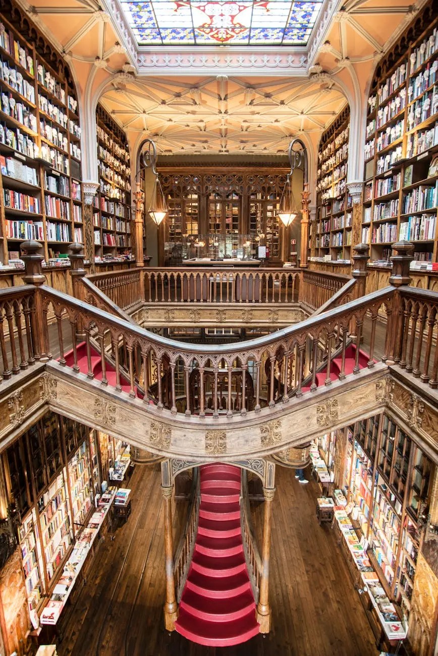 Interior view of a beautiful, ornate library featuring wooden bookshelves filled with books, a grand staircase with red carpet, and a stained glass ceiling.
