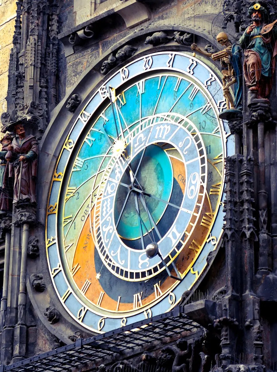 Close-up of the intricate clock face of the Glockenspiel in Munich, showcasing colorful zodiac symbols, Roman numerals, and decorative figures.