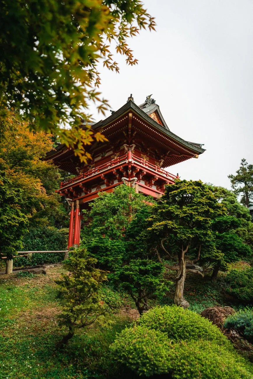 A serene Japanese-style pagoda nestled among lush greenery and colorful autumn foliage.