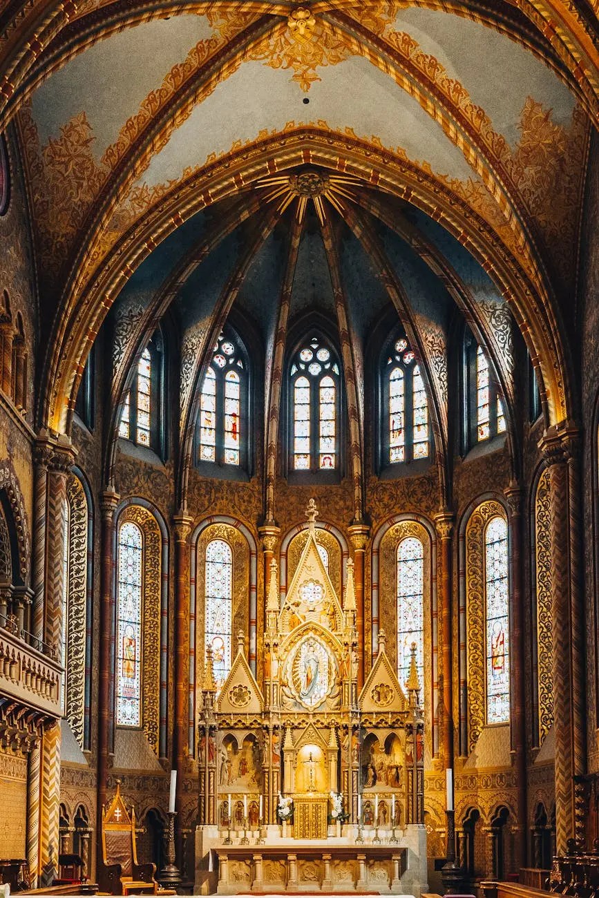 Interior view of a beautifully decorated church with stained glass windows and ornate golden altar.
