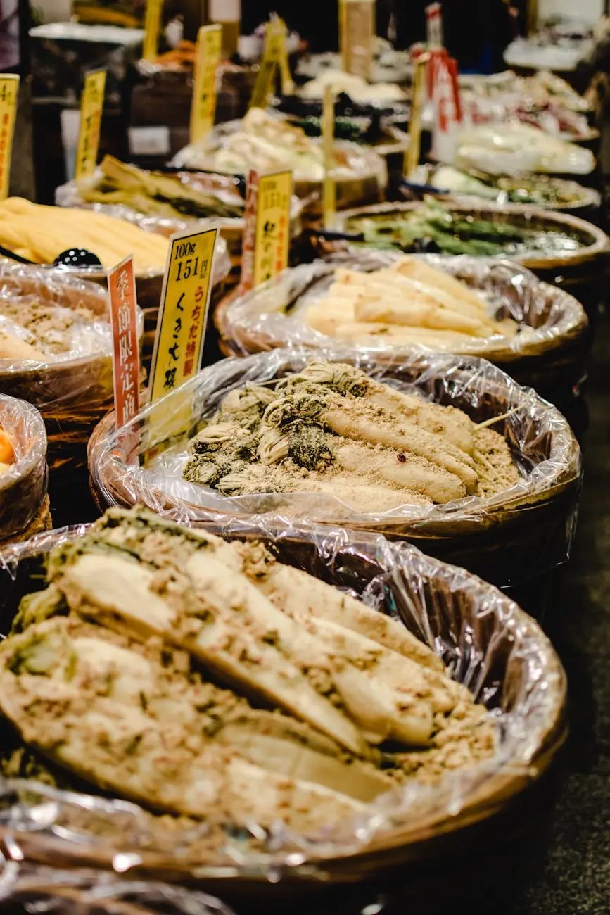 A vibrant display of various traditional Japanese foods and ingredients arranged in baskets at Nishiki Market, Kyoto, with signage indicating prices and product information.