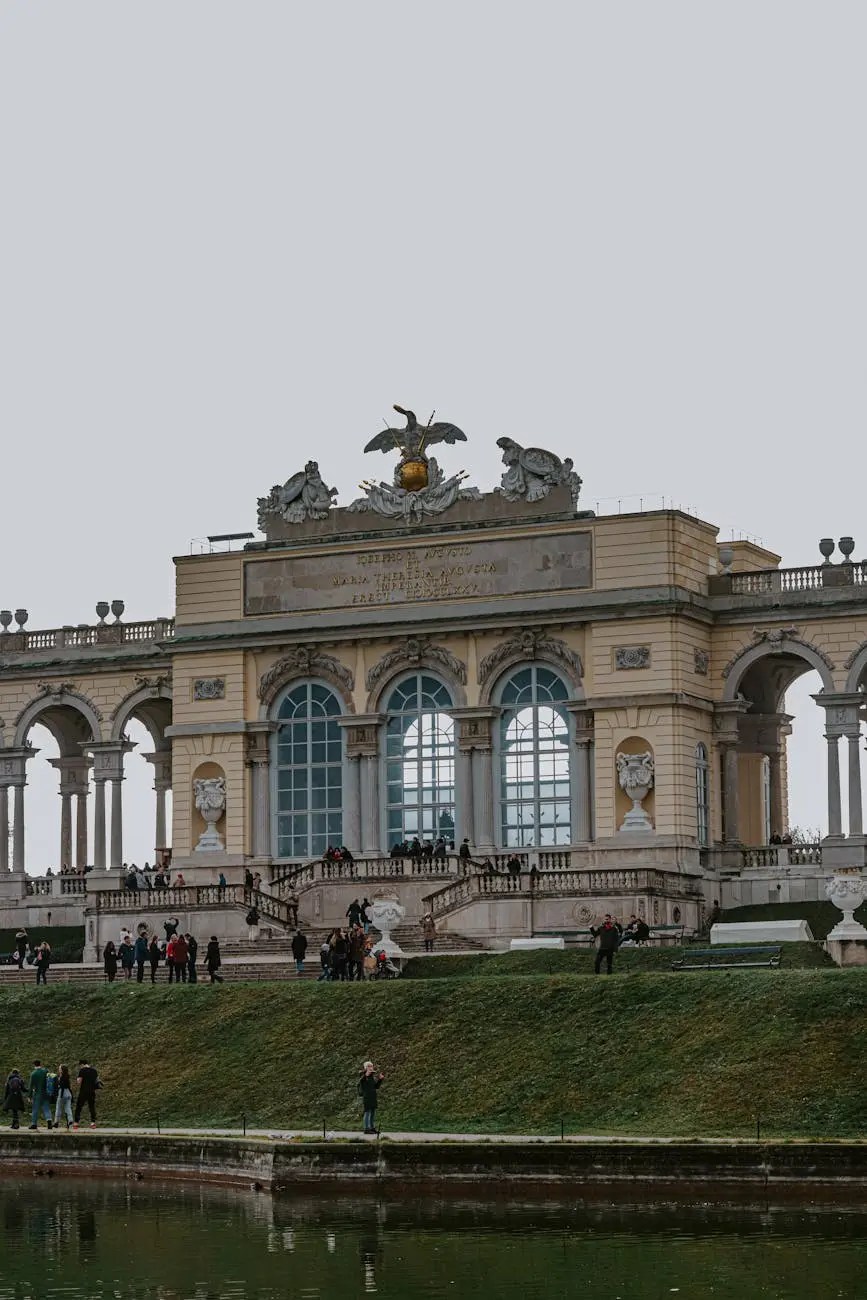 View of the Gloriette in Schönbrunn Palace gardens, showcasing its classical architecture and people enjoying the serene surroundings.