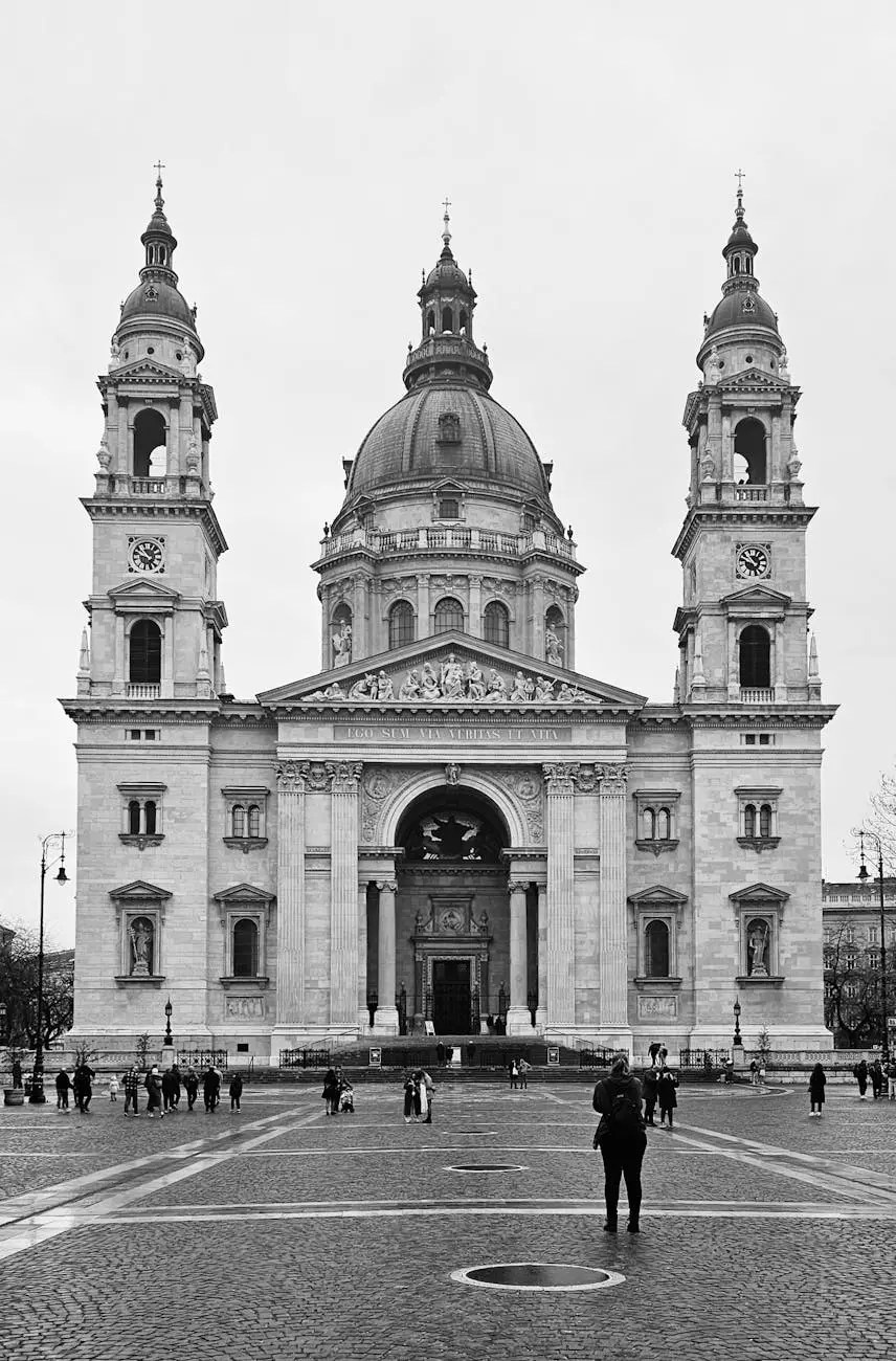 Black and white photograph of St. Stephen's Basilica in Budapest, showcasing its impressive facade and twin towers, with people gathering in the square in front.