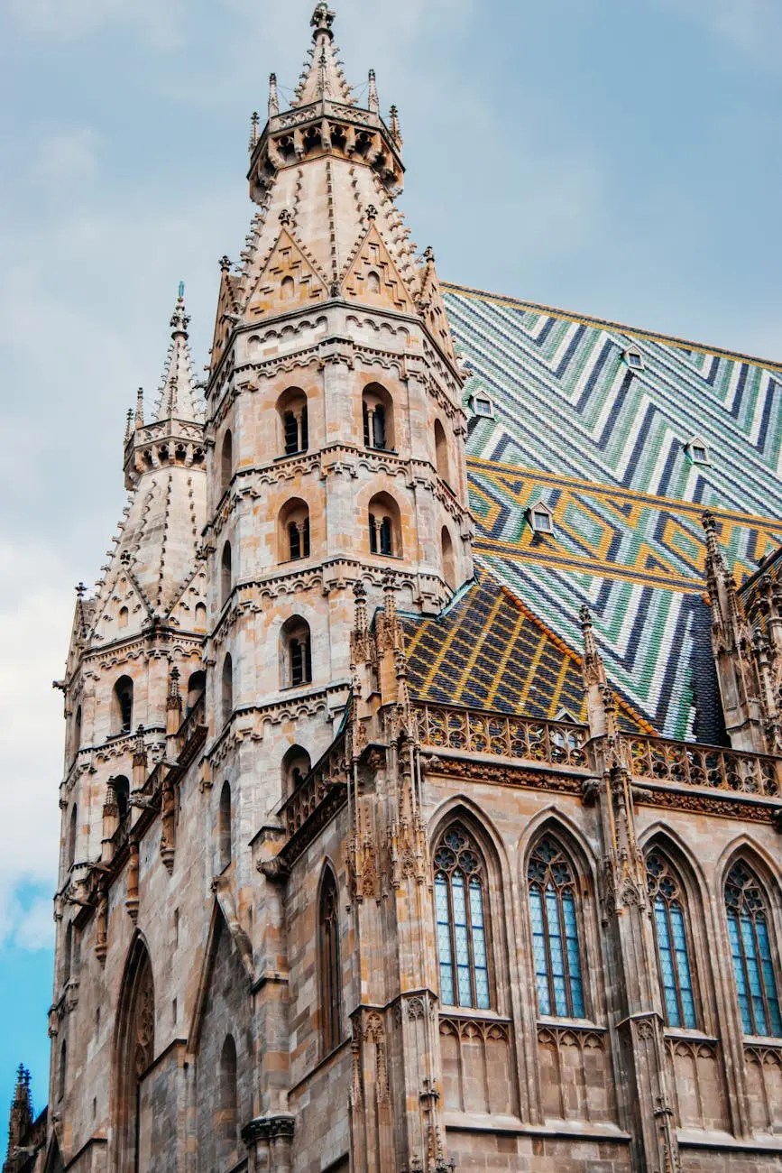 Close-up view of the intricate architecture and spires of St. Stephen's Cathedral in Vienna, showcasing its Gothic design and colorful patterned roof.