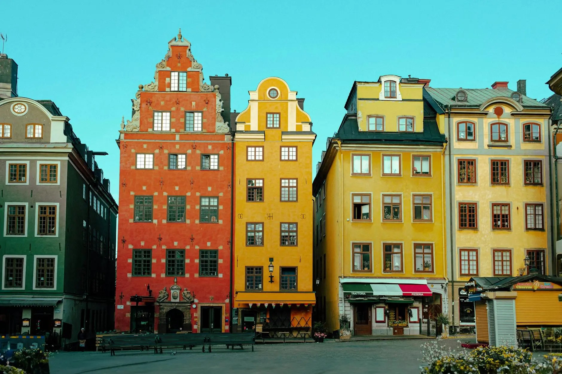 Colorful buildings in Gamla Stan, Old Town, Stockholm, under a clear blue sky.