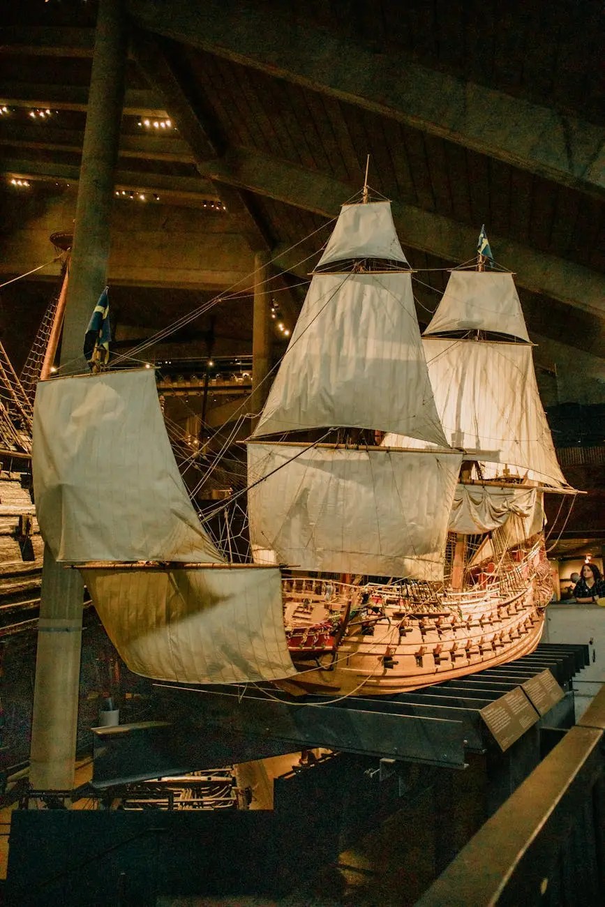A detailed view of the Vasa warship, displayed inside the Vasa Museum in Stockholm, showcasing its sails and intricate craftsmanship.